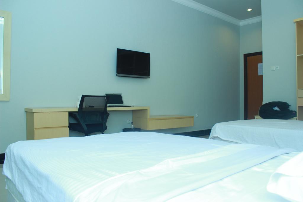 Raja Residence Jambi Джамбі Номер фото
