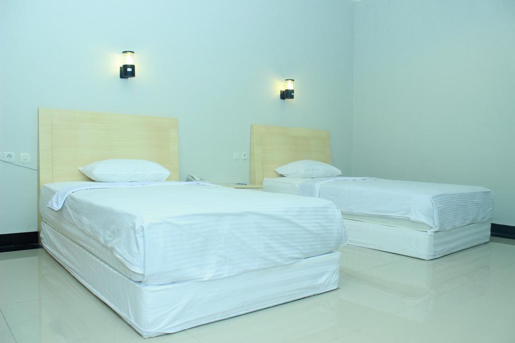 Raja Residence Jambi Джамбі Номер фото