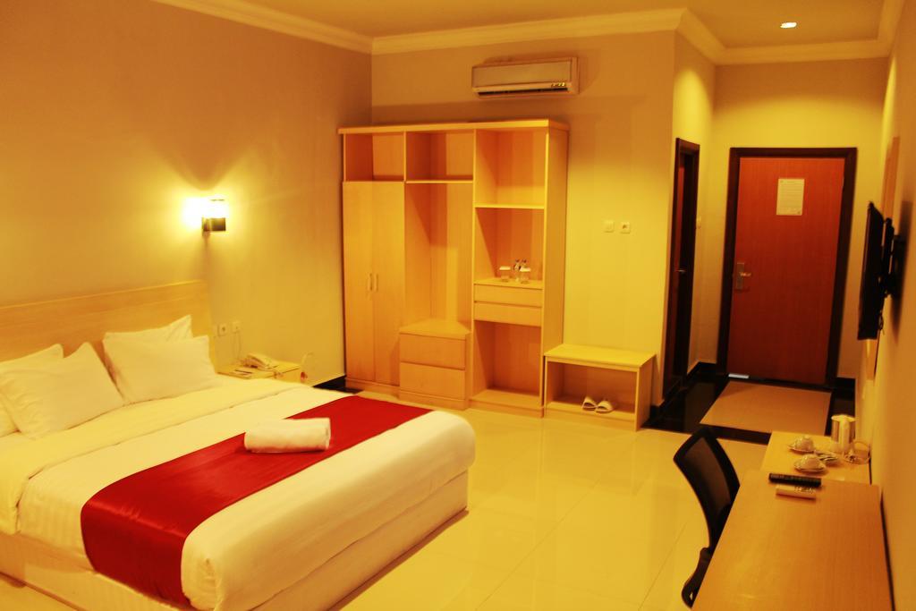 Raja Residence Jambi Джамбі Номер фото