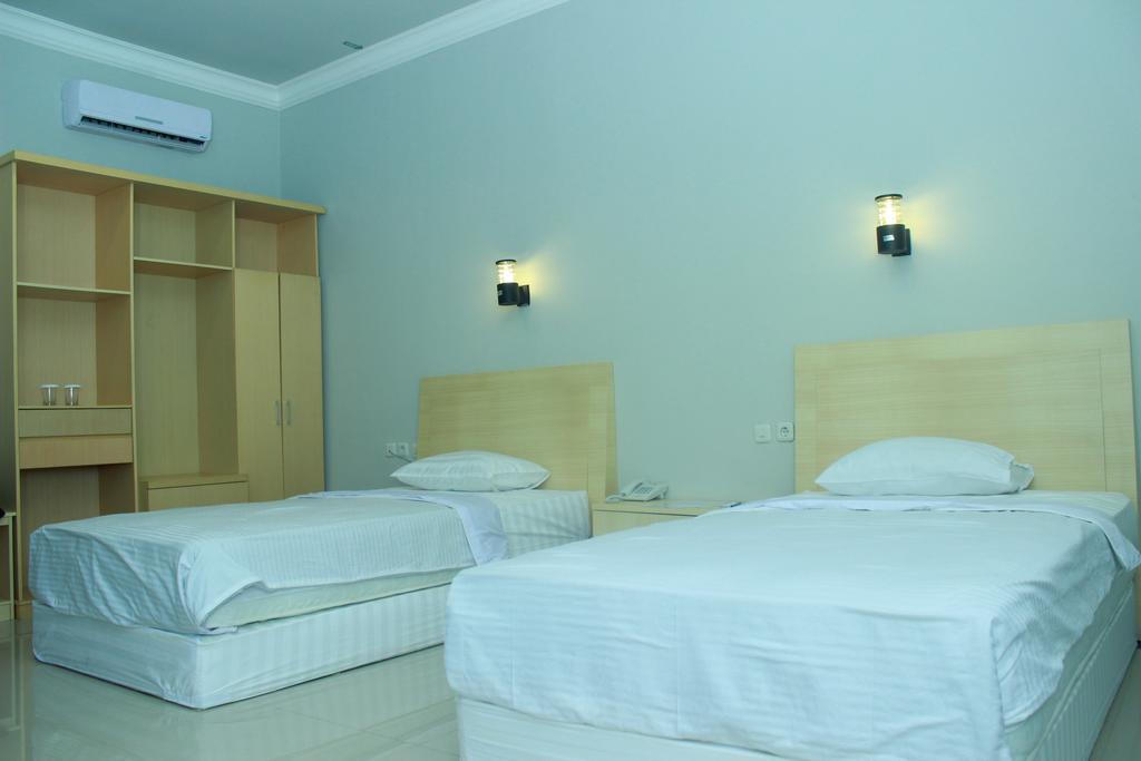 Raja Residence Jambi Джамбі Номер фото